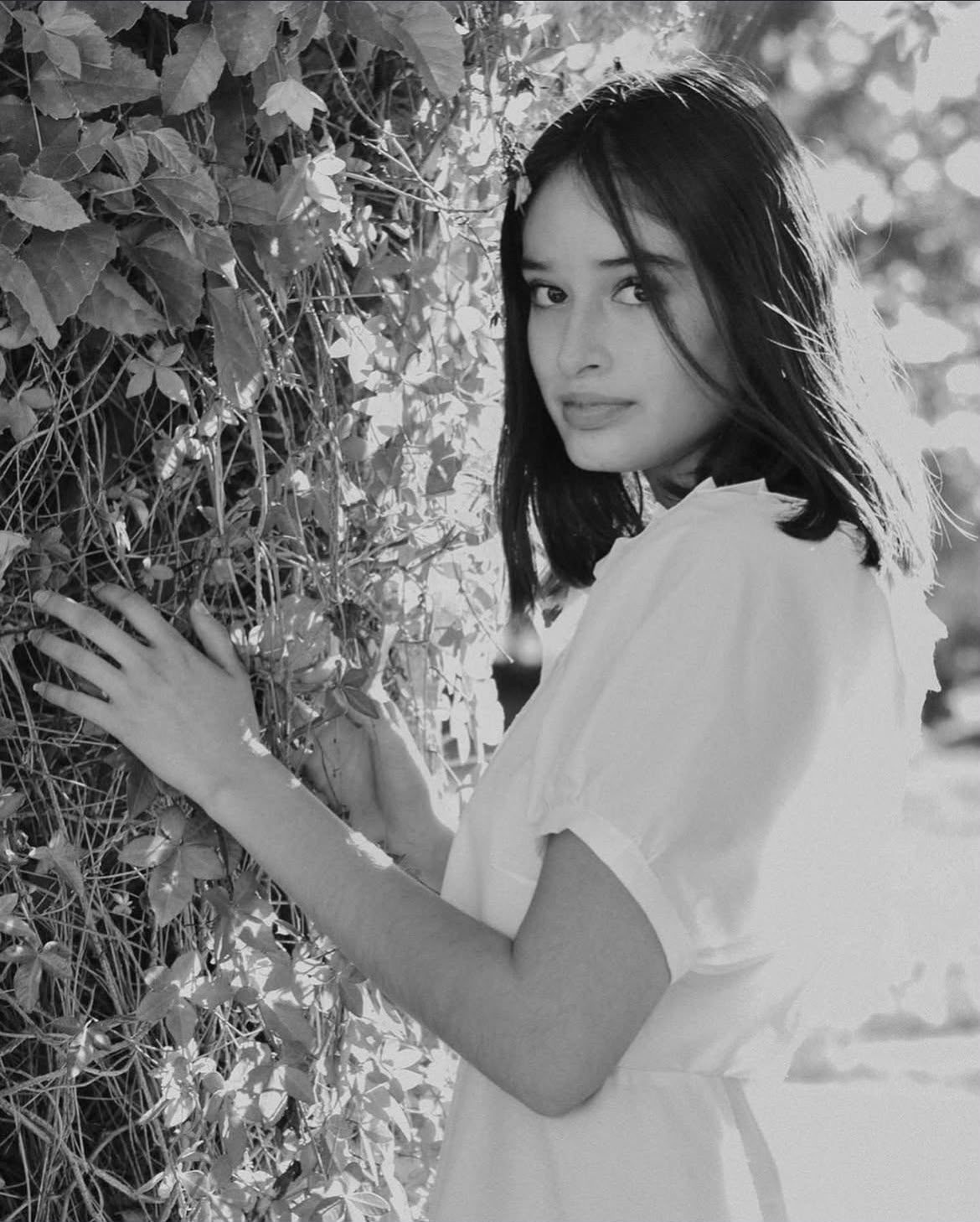Portrait, by the vines